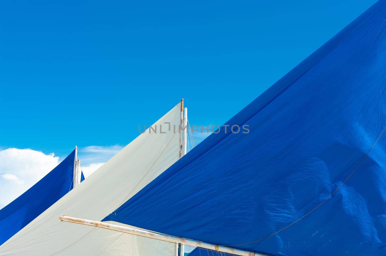 white sail against a tropical background