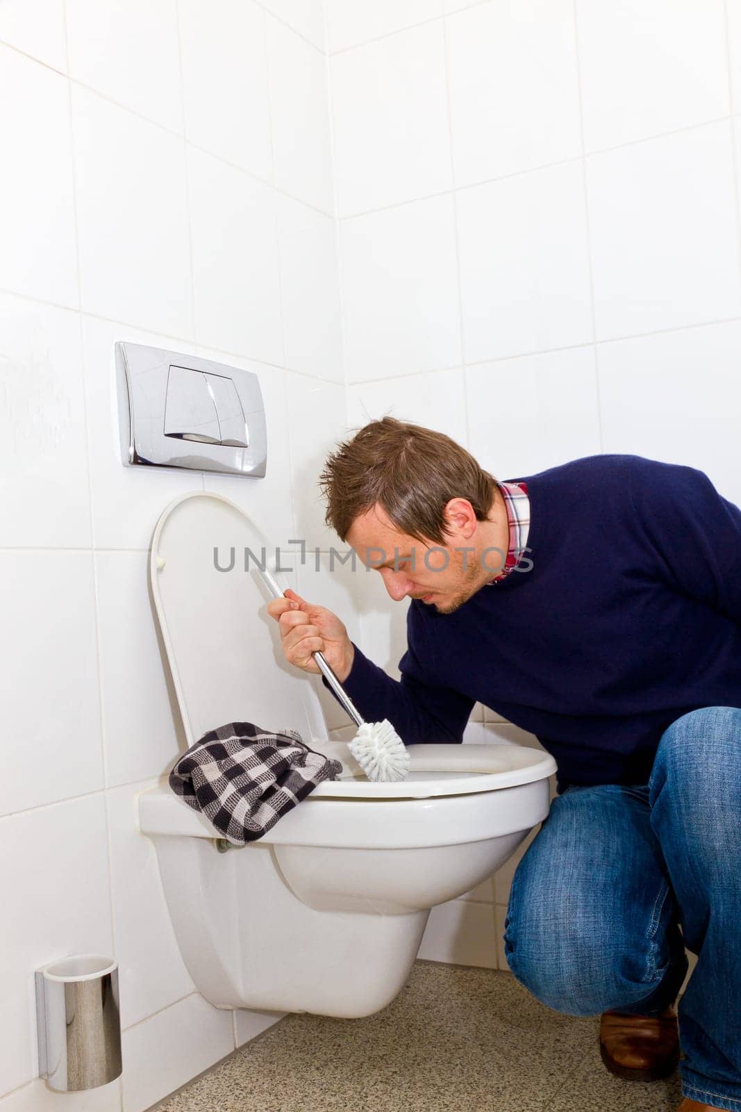 Man cleaning toilet