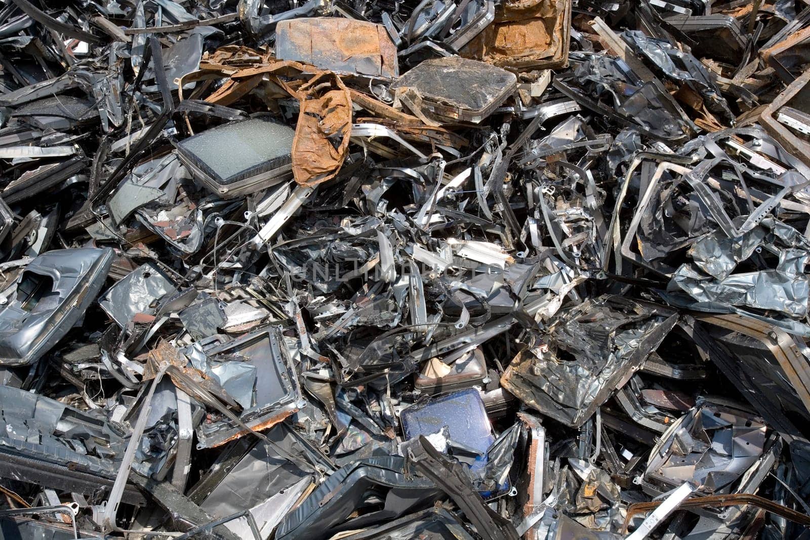 Stack of Metal Garbage in front of blue sky