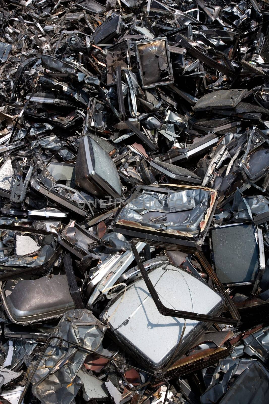 Stack of Metal Garbage in front of blue sky