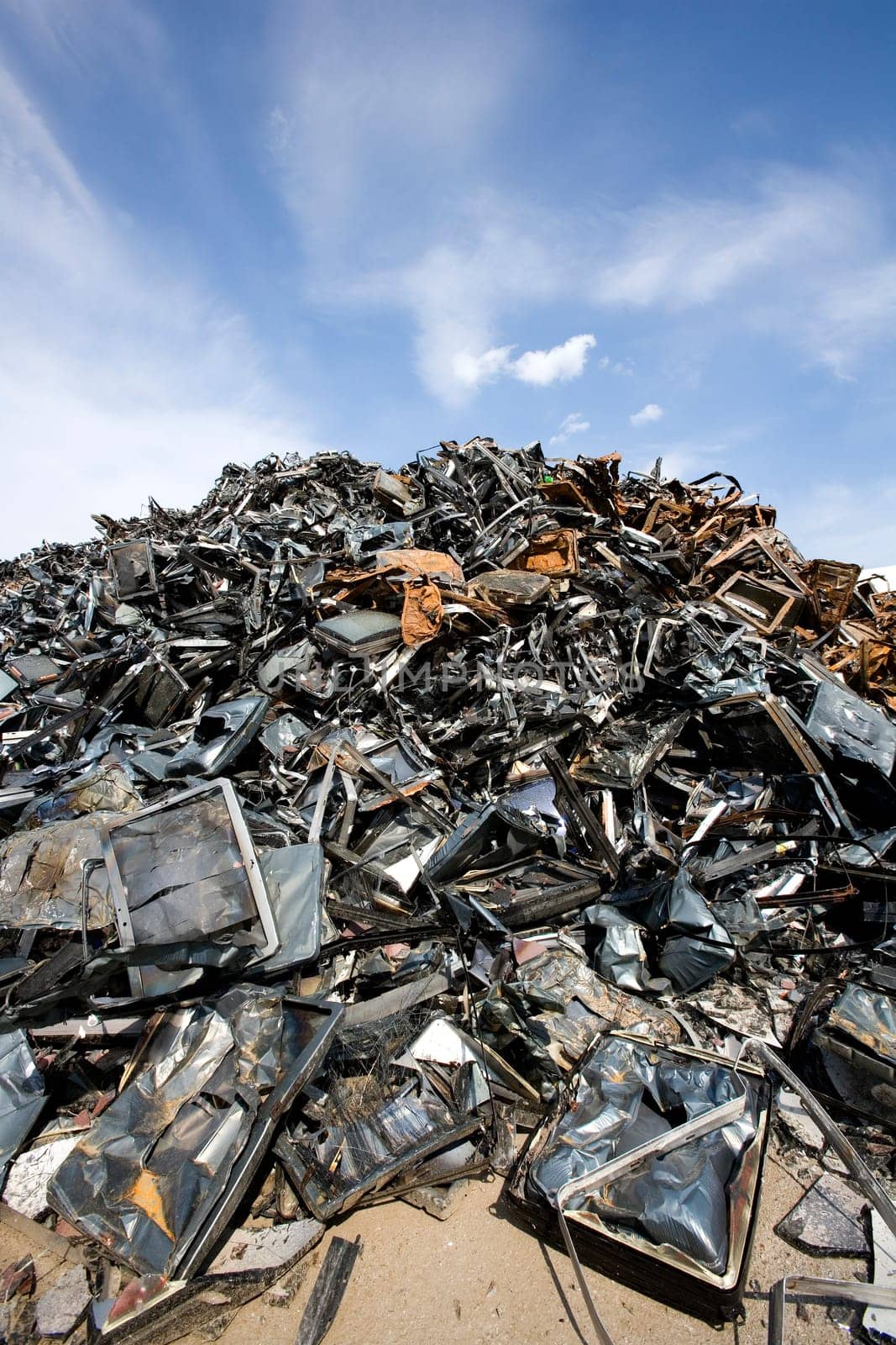 Stack of Metal Garbage in front of blue sky