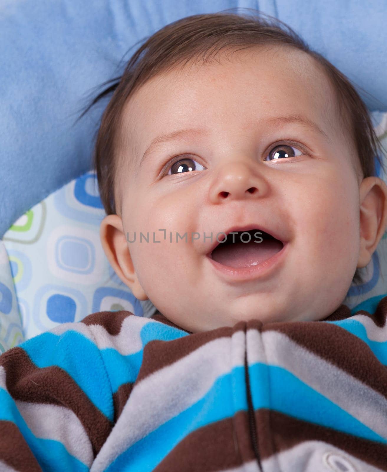 Portrait of a baby boy laughing and smiling