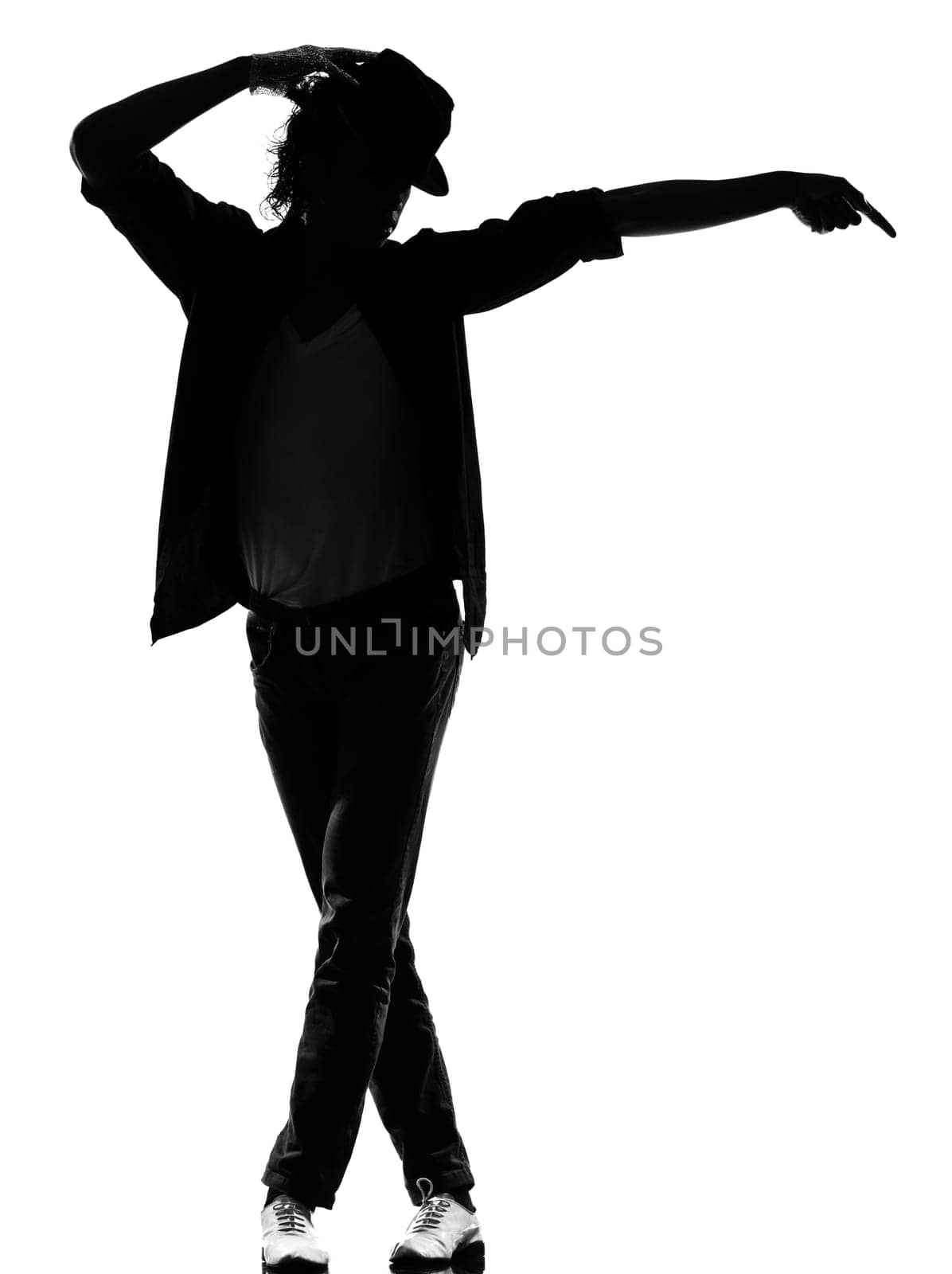 full length silhouette of a young man dancer dancing funky hip hop r&amp b on  isolated  studio white background