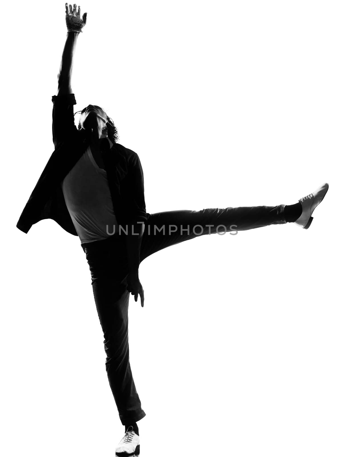 full length silhouette of a young man dancer dancing funky hip hop r&amp b on  isolated  studio white background