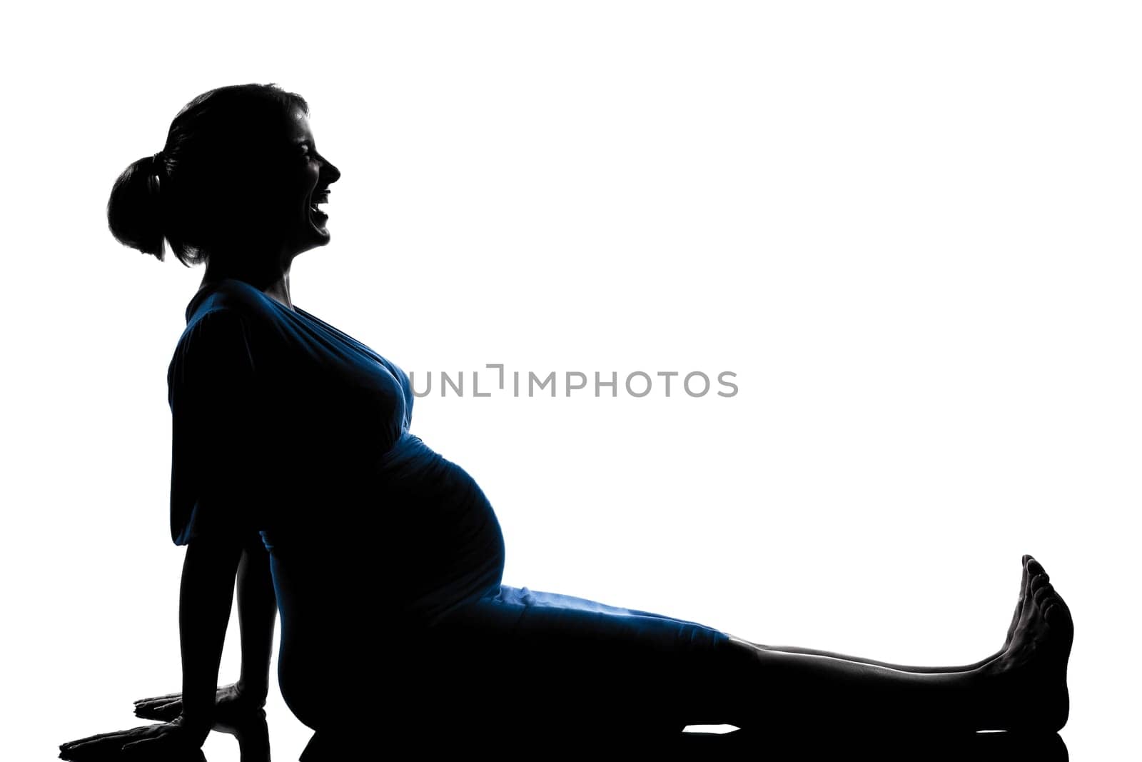 beautiful caucasian pregnant woman laughing happy in silhouette on studio isolated white background