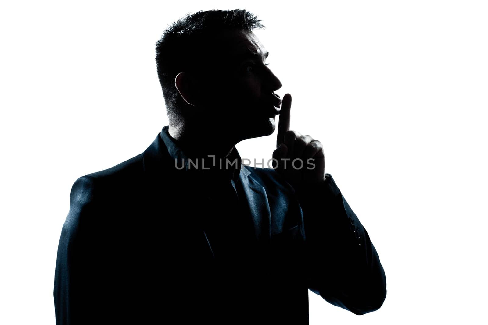 one caucasian man hushing profile portrait silhouette in studio isolated white background