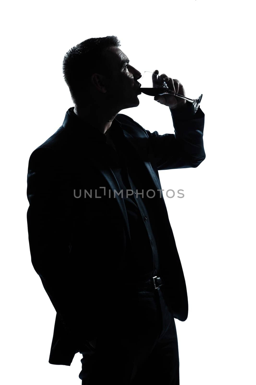 one caucasian man portrait silhouette drinking red wine in studio isolated white background
