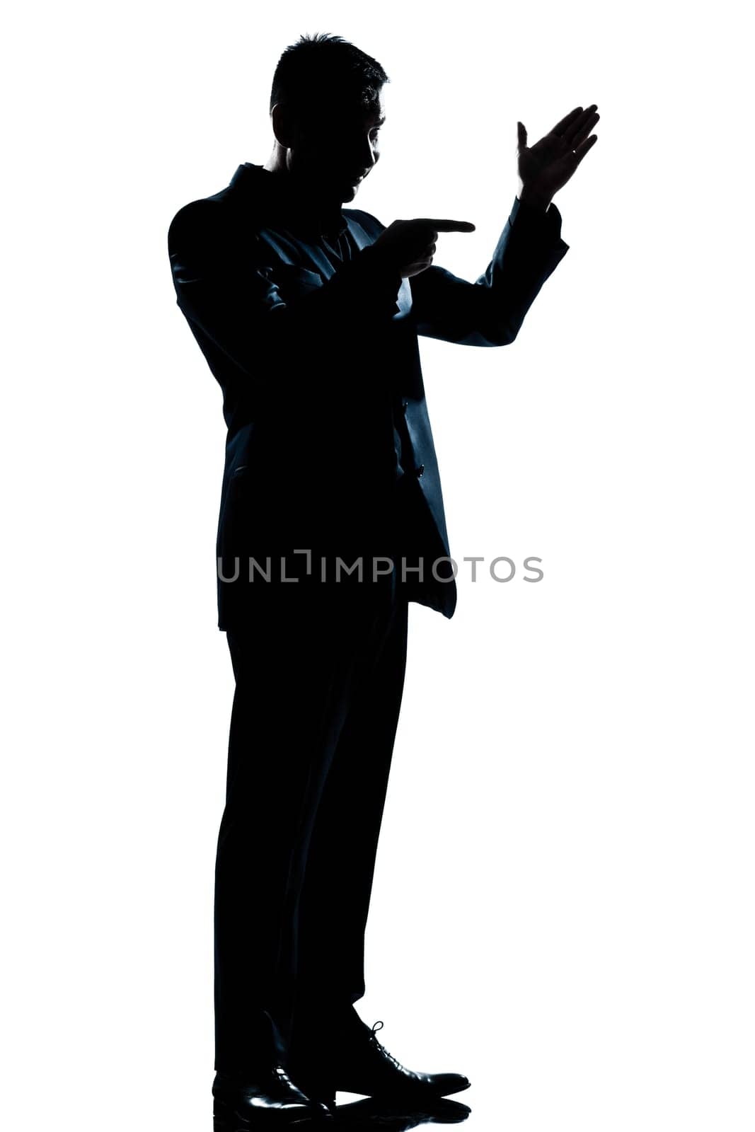 one caucasian man friendly menacing full length silhouette in studio isolated white background