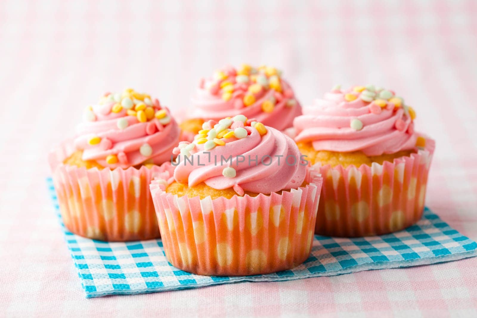 Close-up of delicious pink muffins. Studio shot.