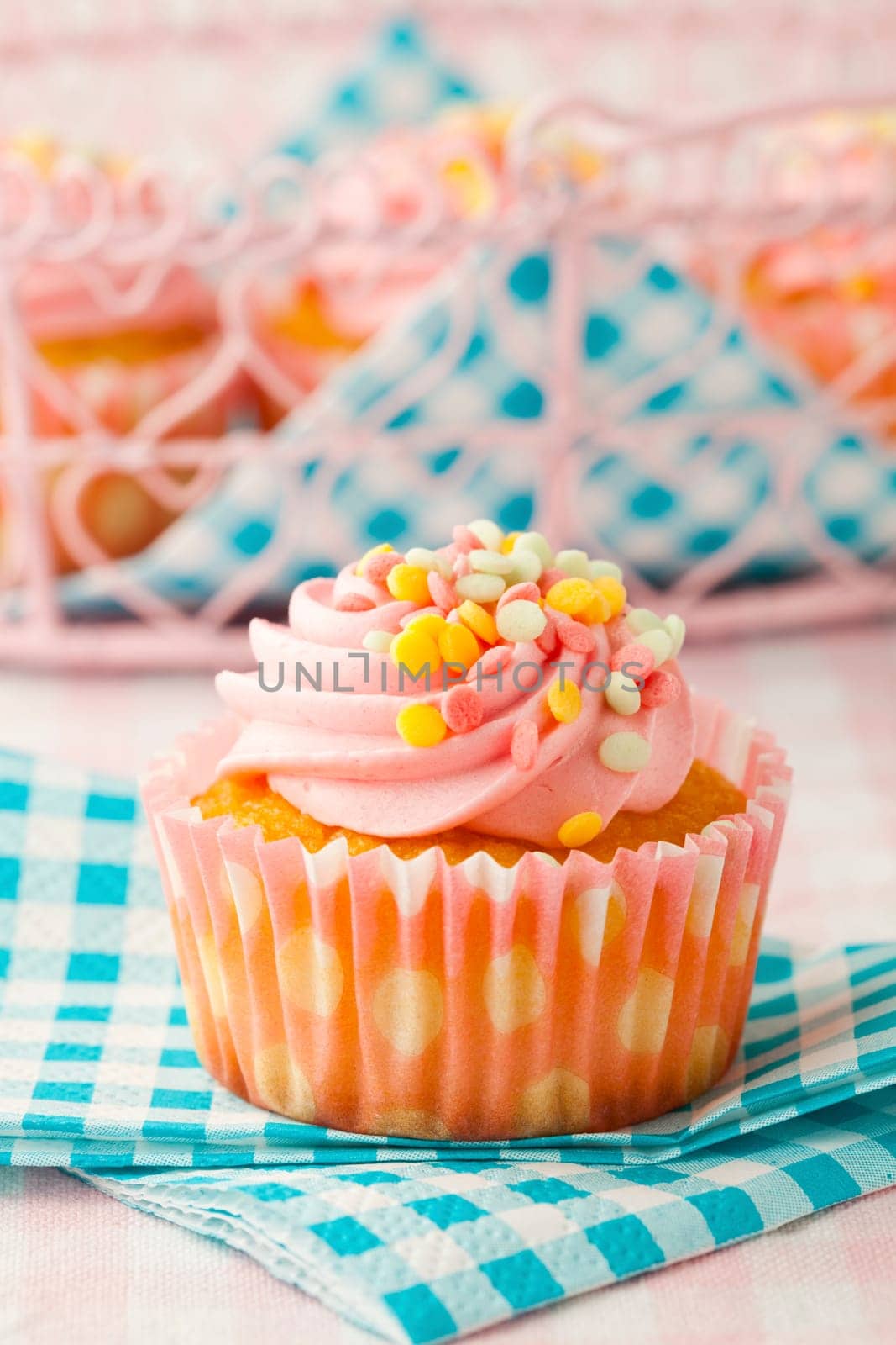 Close-up of delicious pink muffin. Studio shot.