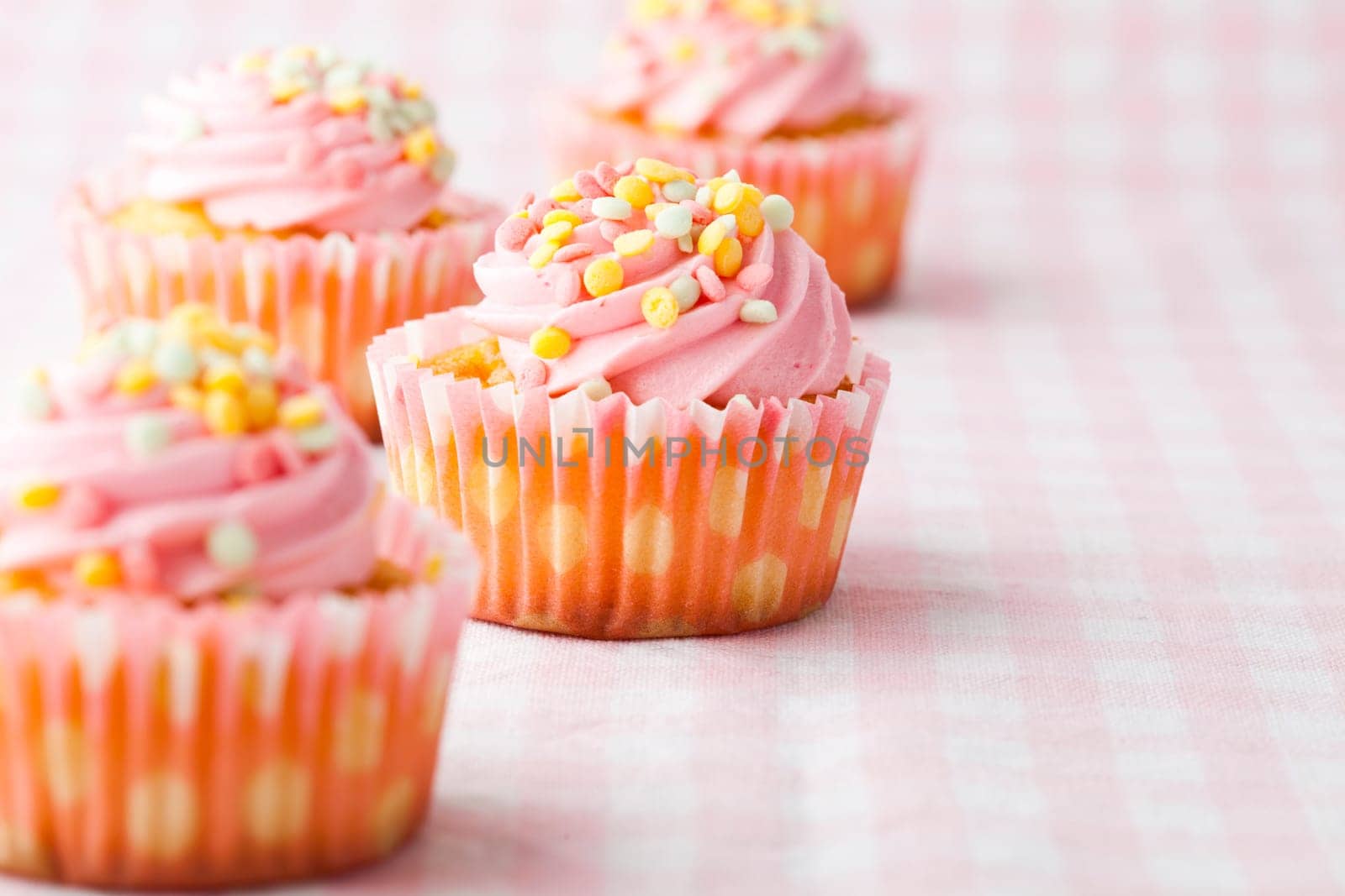 Close-up of delicious pink muffins. Studio shot.
