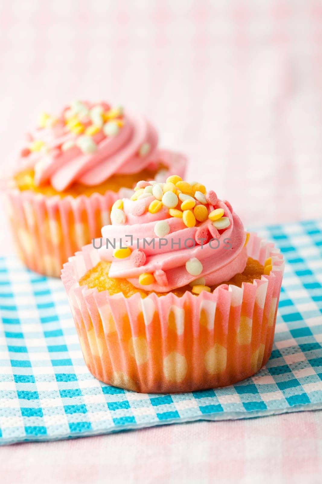 Close-up of delicious pink muffins. Studio shot.