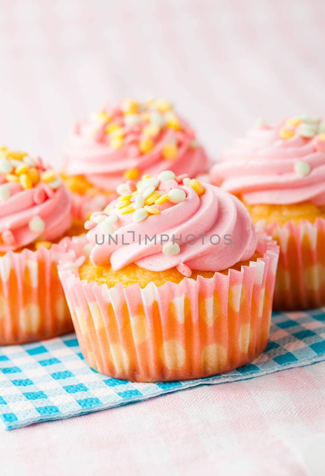 Close-up of delicious pink muffins. Studio shot.