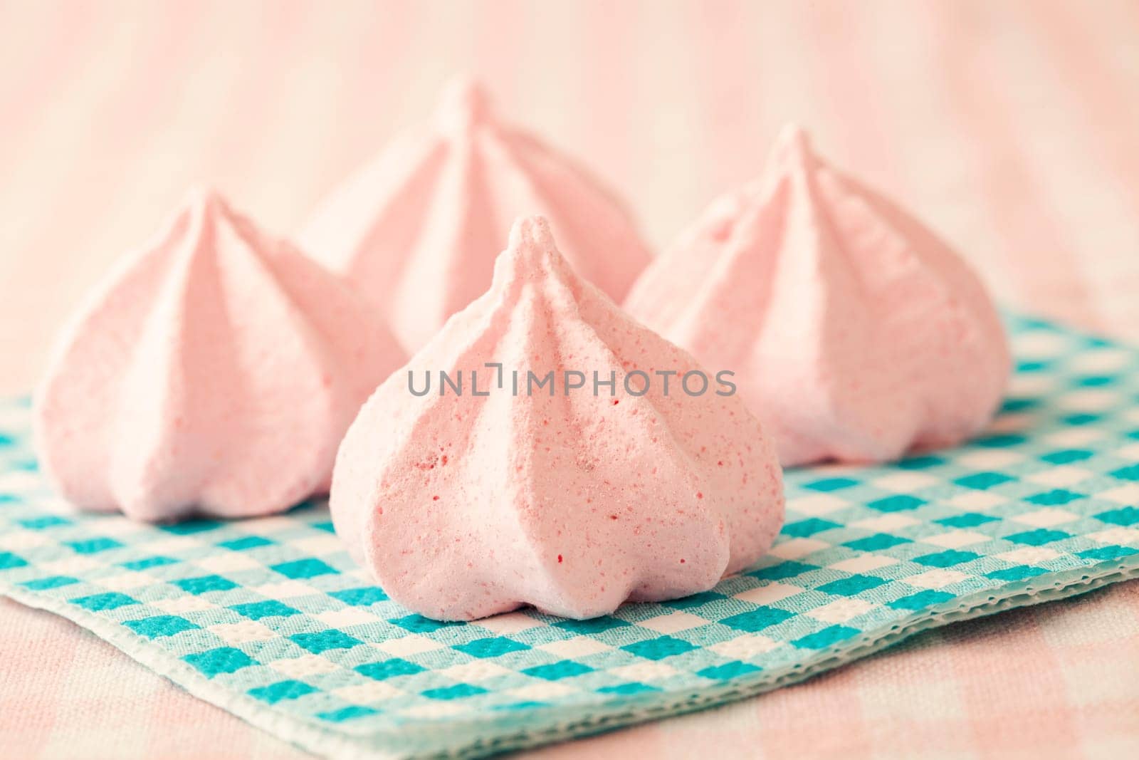 Close-up of delicious pink meringue. Studio shot.