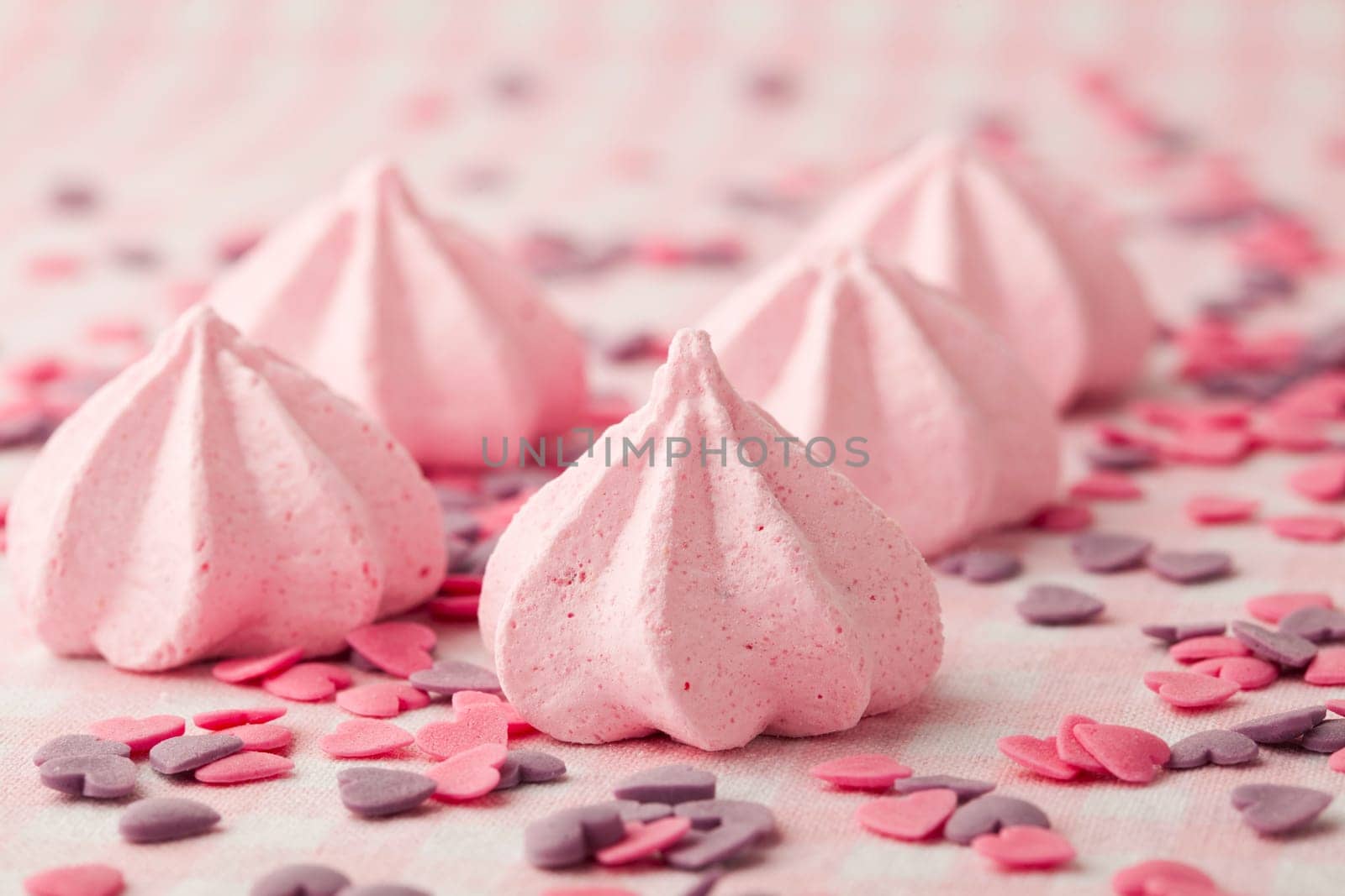 Close-up of delicious pink meringue. Studio shot.
