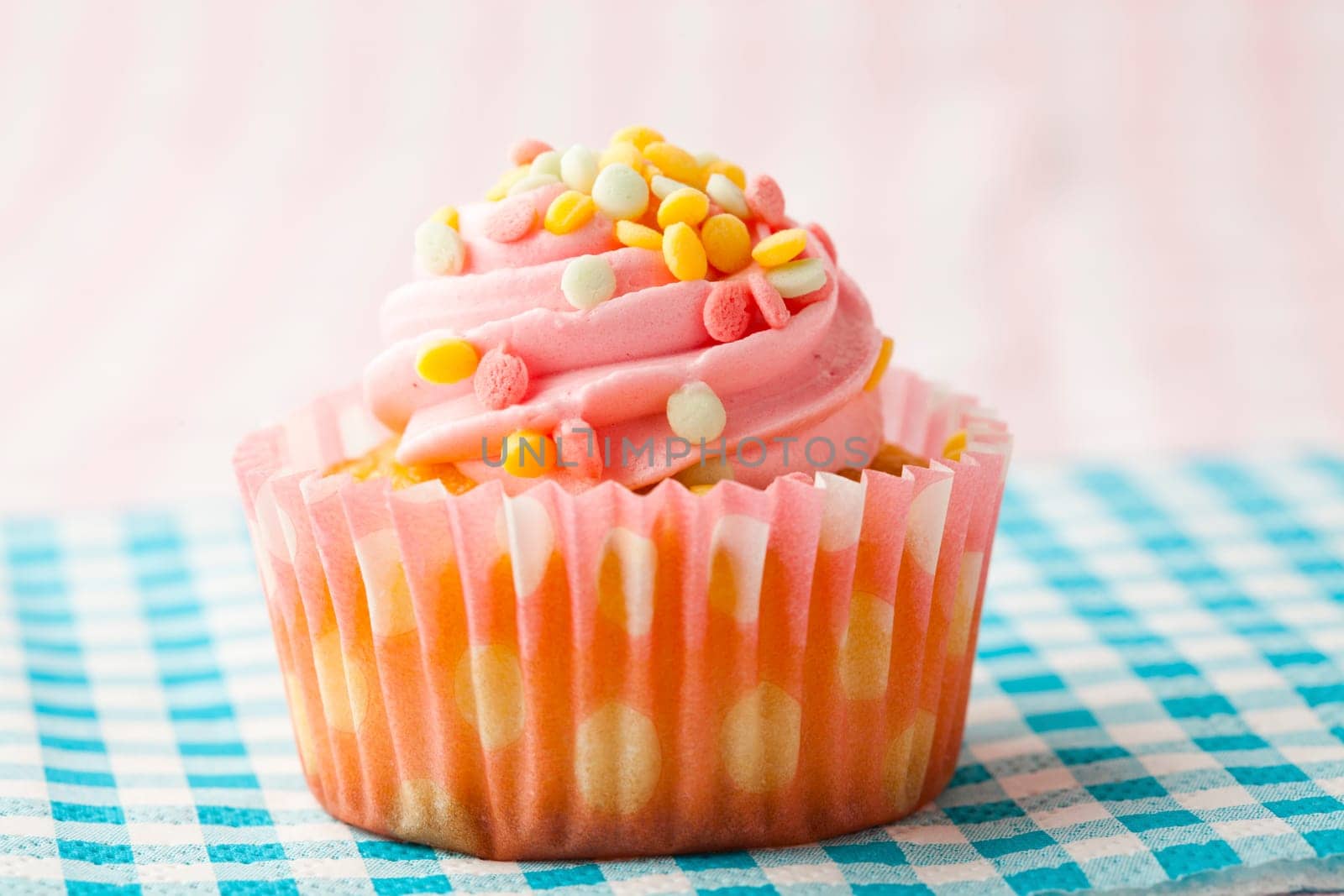 Close-up of delicious pink muffin. Studio shot.
