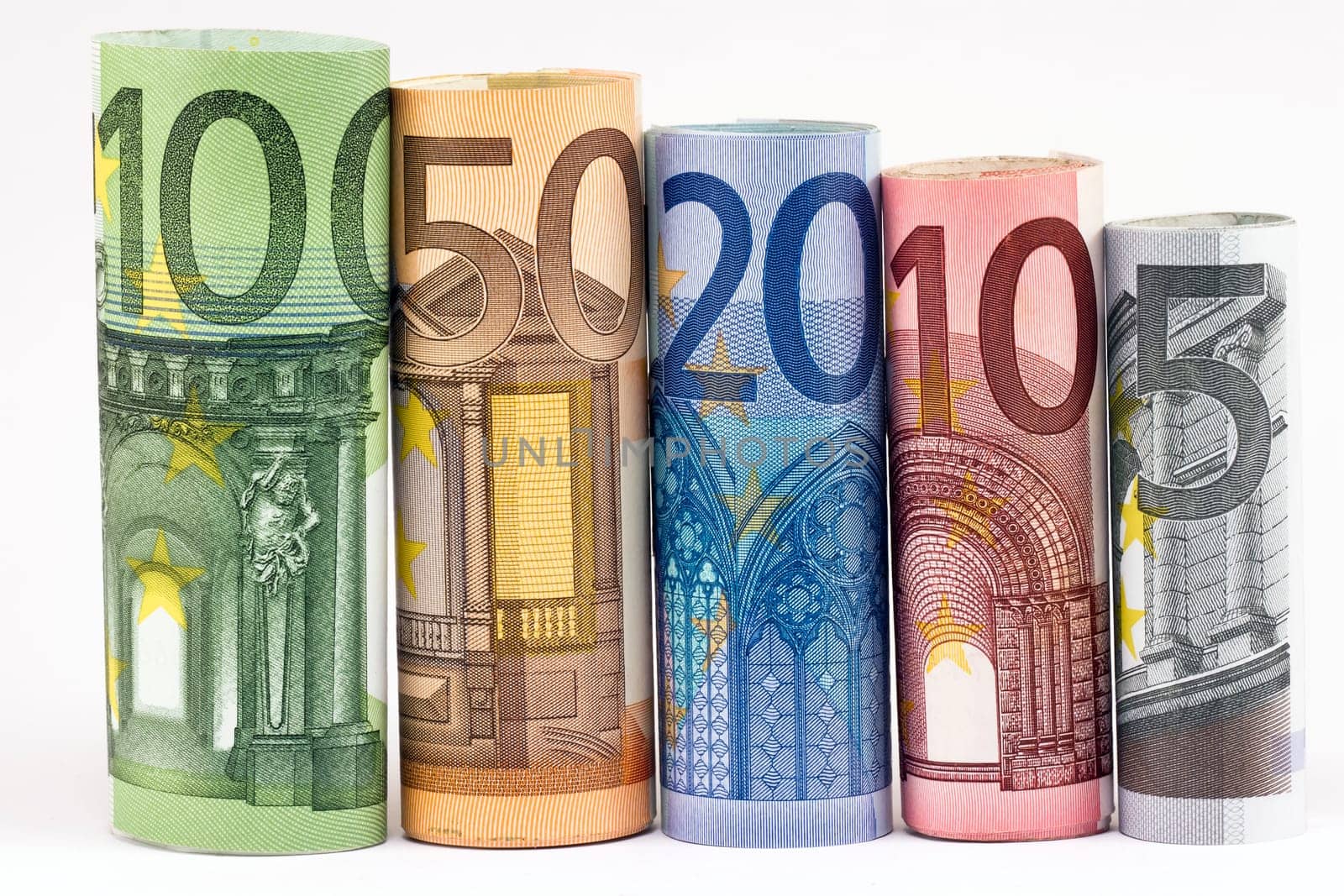 Rolls of various Euro banknotes isolated on white.