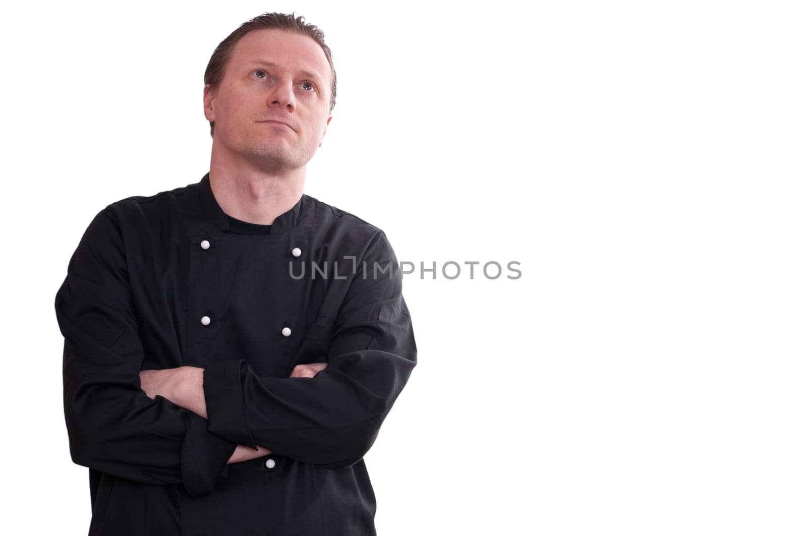 A man as a cook looks up to think