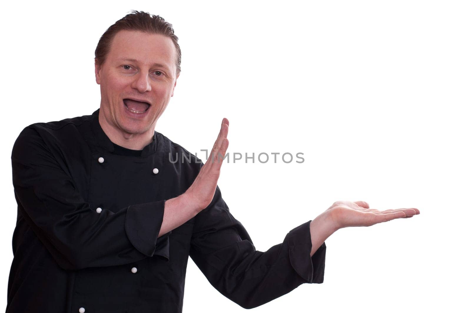 A man as a cook is funny laughing and holding something with his hands