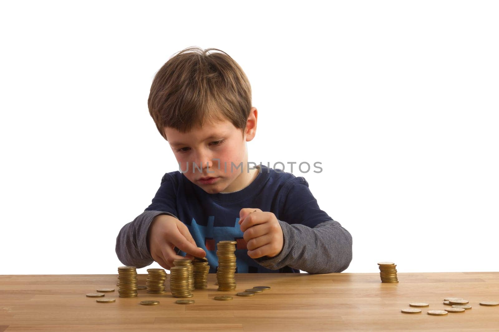 Boy builds money towers out of 50 cent coins