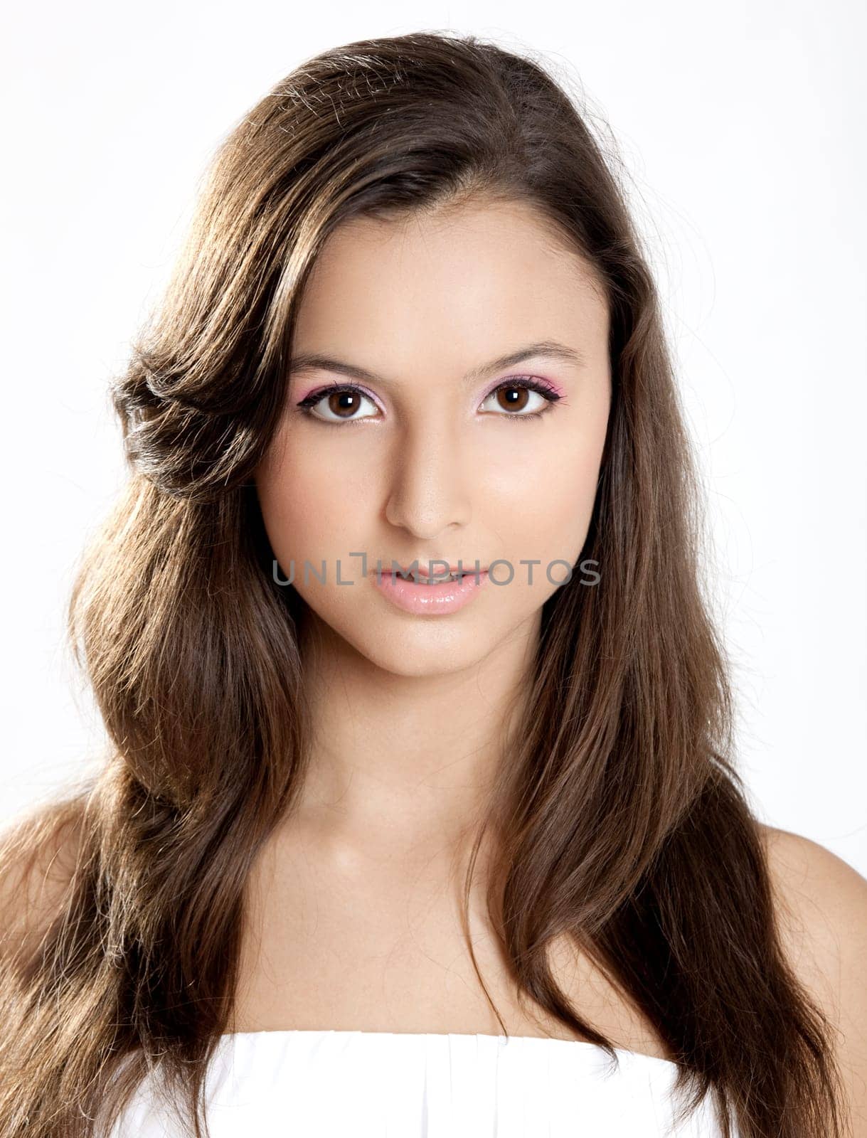 Close-up portrait of a beautiful teenage girl smilling