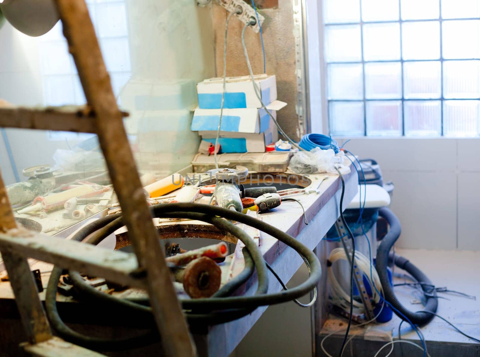 bathroom improvement repair with messy clutter and dust in tools