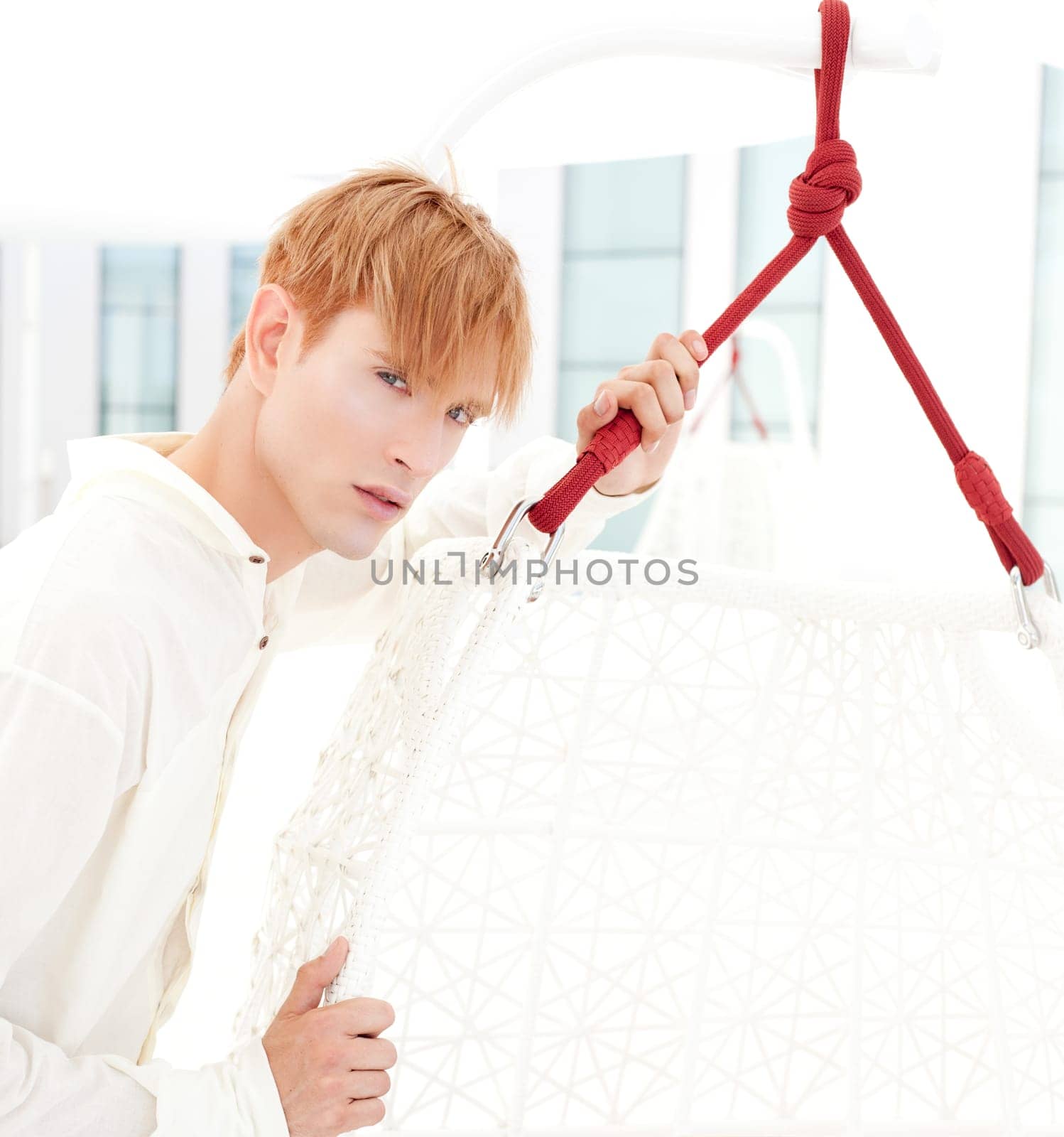 blond modern man portrait in summer terrace vampire inspiration