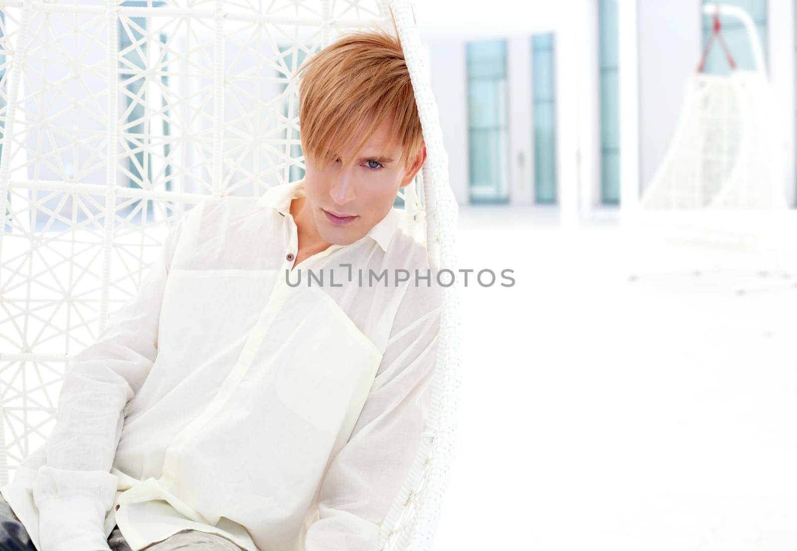 blond modern man portrait in summer terrace vampire inspiration