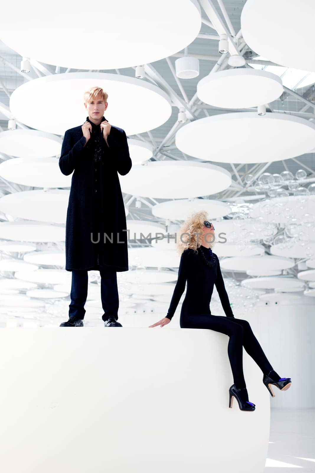 Blond couple classic movie secret agent and sexy girl in black