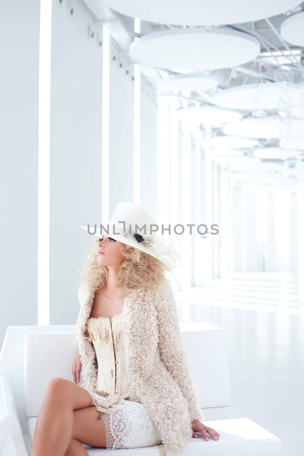 blond fashion woman with eighteenth century corset haute couture