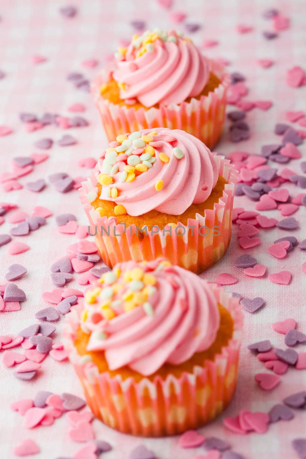 Close-up of delicious pink muffins. Studio shot.