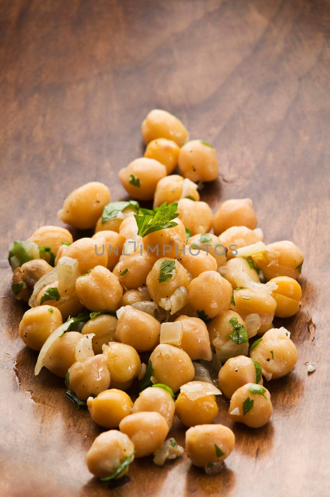 Fresh chickpea salad in a bowl close up shoot