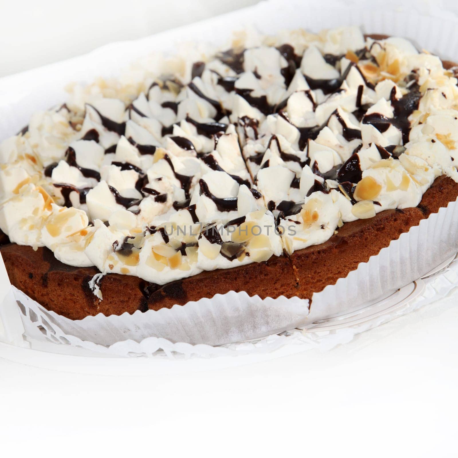 Deliscious Fresh Cake decorated with icing pinnacles drizzled with chocolate