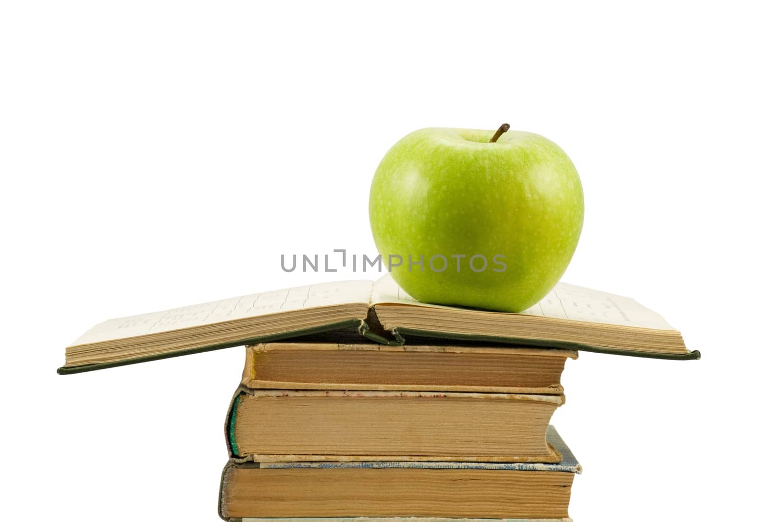 open book with green apple, isolated on white background