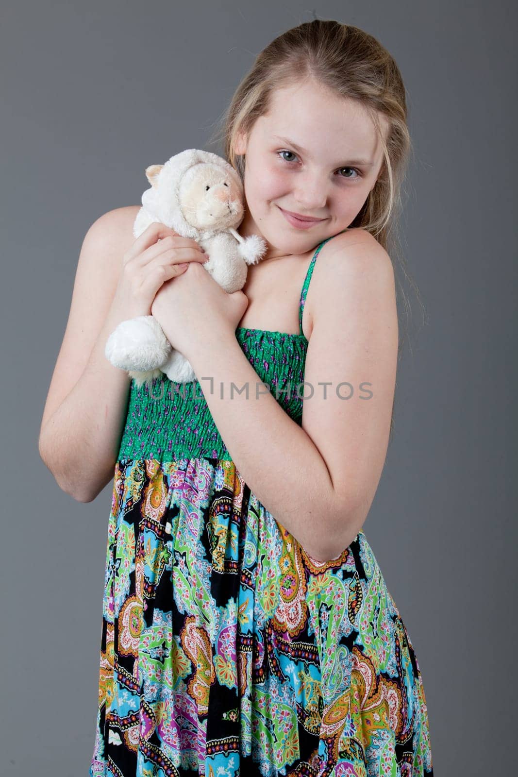 young happy girl.  little girl on a gray background
