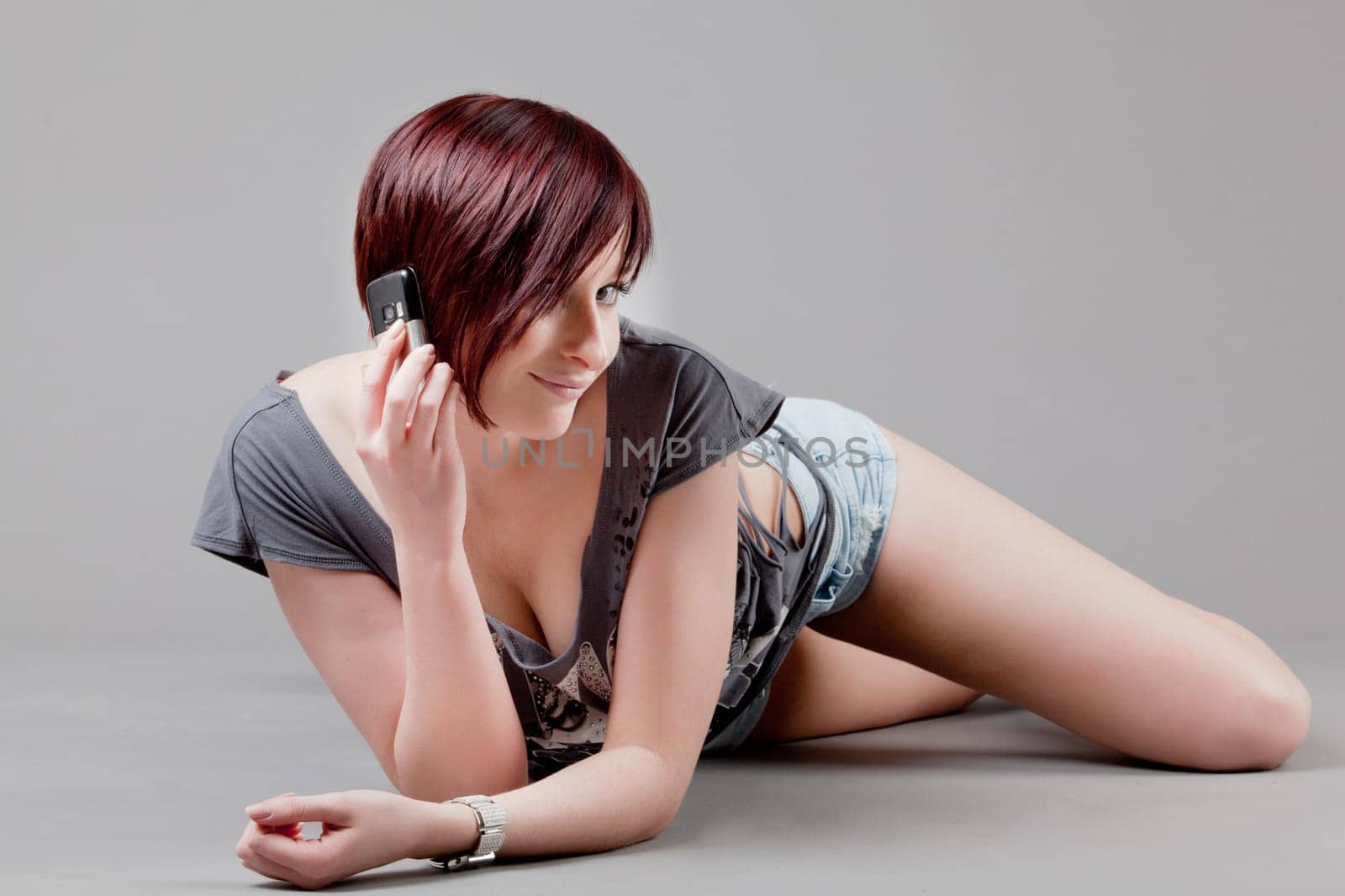 attractive smiling woman. Portrait of an attractive young woman.  lady posing on grey background.