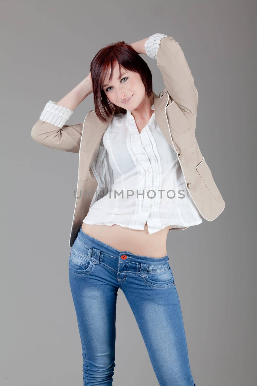 attractive smiling woman. Portrait of an attractive young woman.  lady posing on grey background.