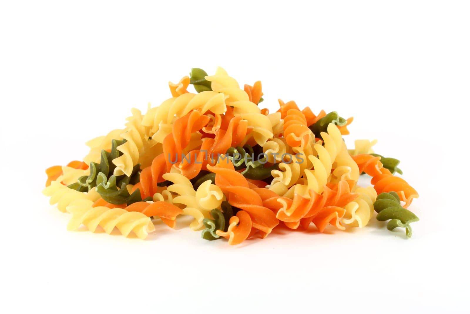 Raw colored pasta fusilli isolated on white background