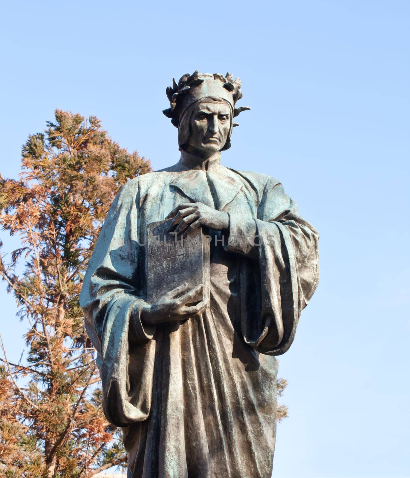 Statue of Dante holding Commedia book in Meridian Hill Park in Washington DC