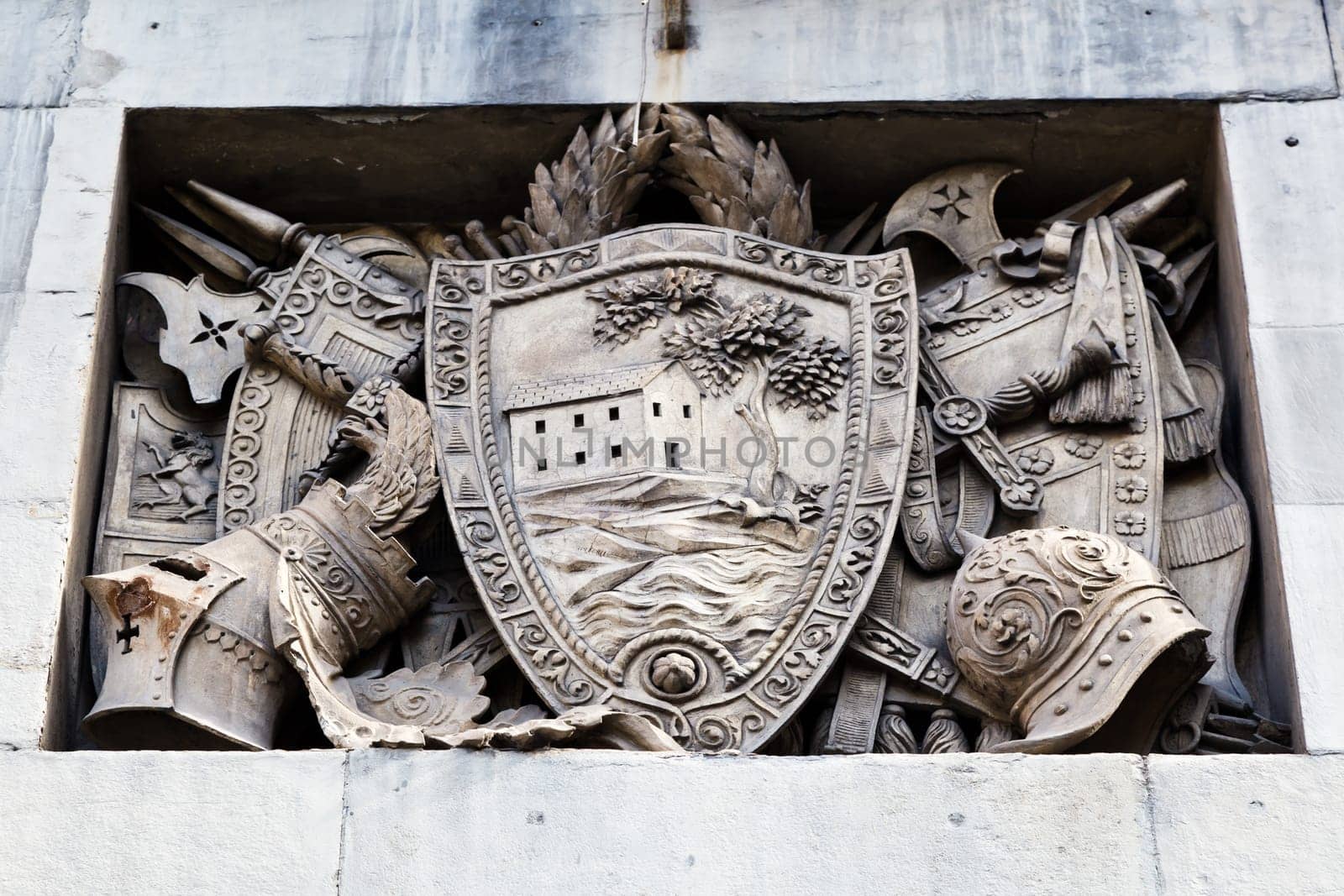 Shield, Helmets and Sword Marble Relief in Genoa, Italy