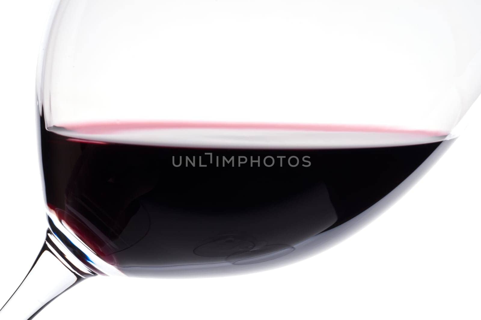 A close-up of Merlot red wine in a Bordeaux wine glass
