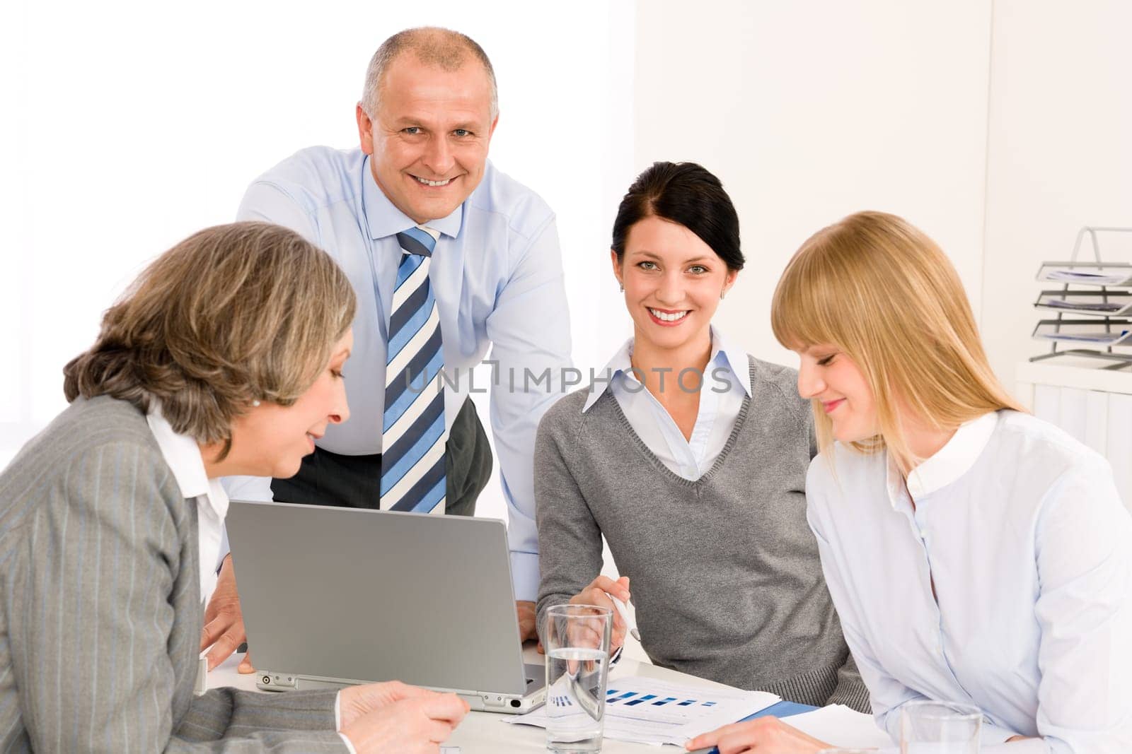 Business team meeting executive businessman with happy colleagues in office