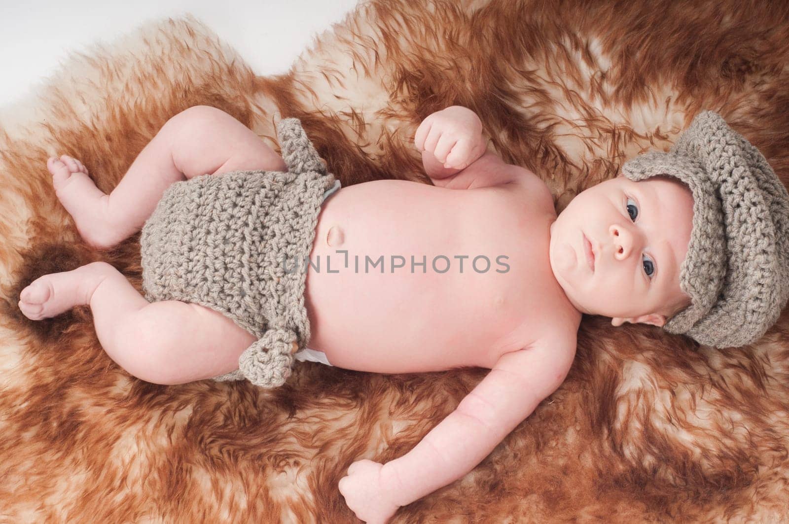 Shot of newborn baby lying on fur