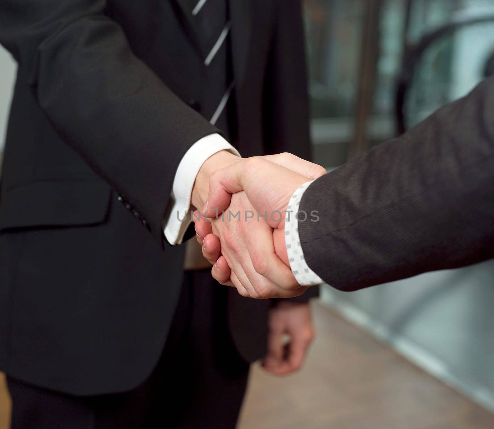 Close-up of a handshake with selective focus