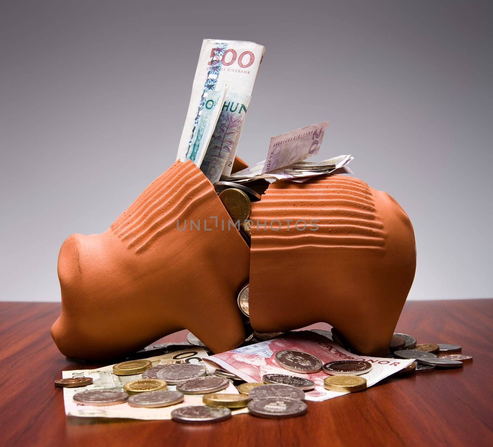 Broken Piggy Bank with Swedish money