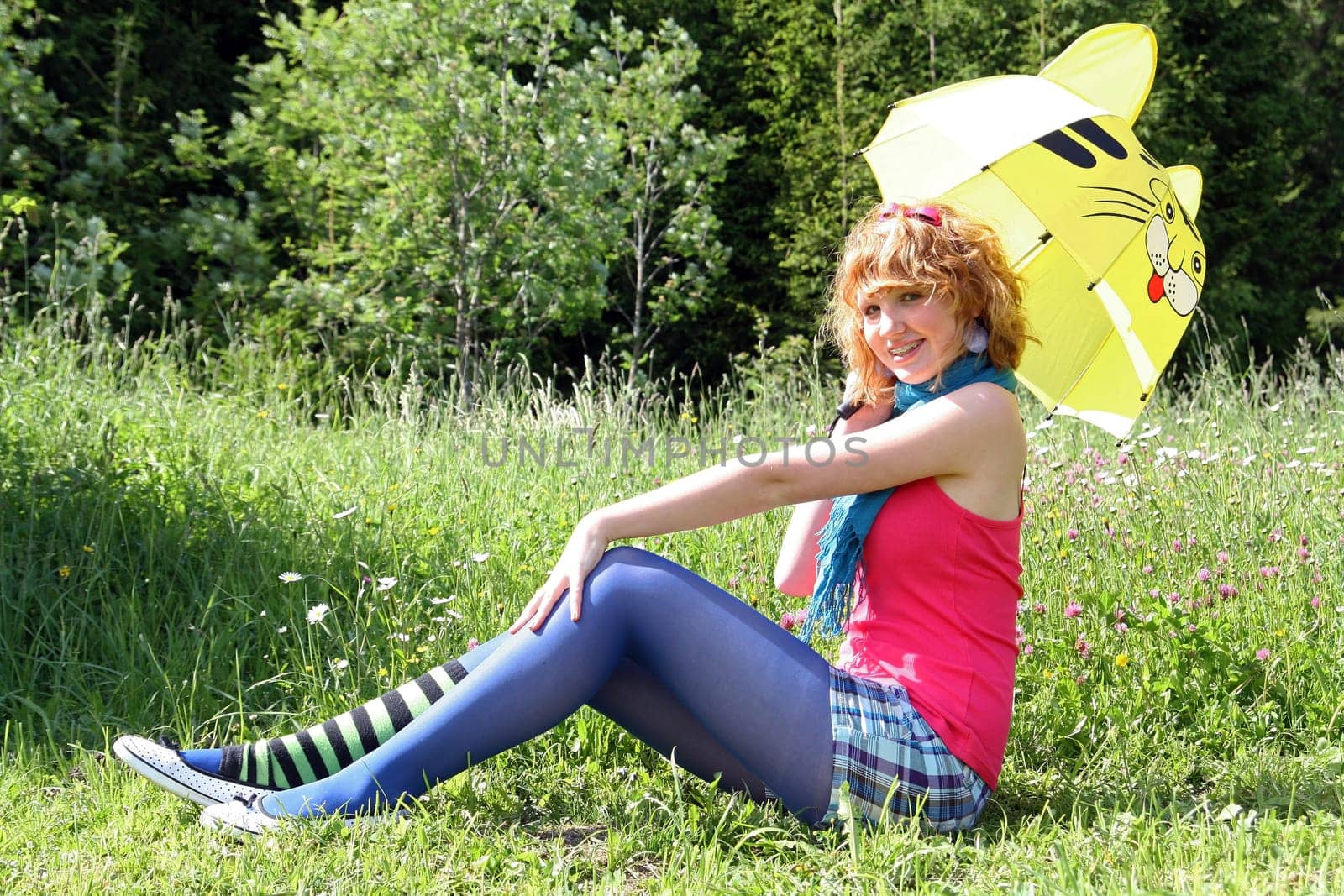 With the parasol in the flower meadow