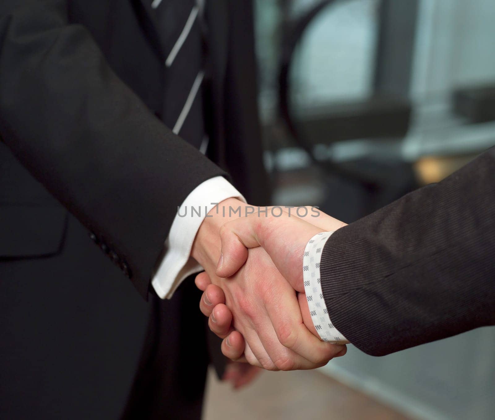 Close-up of a handshake with selective focus
