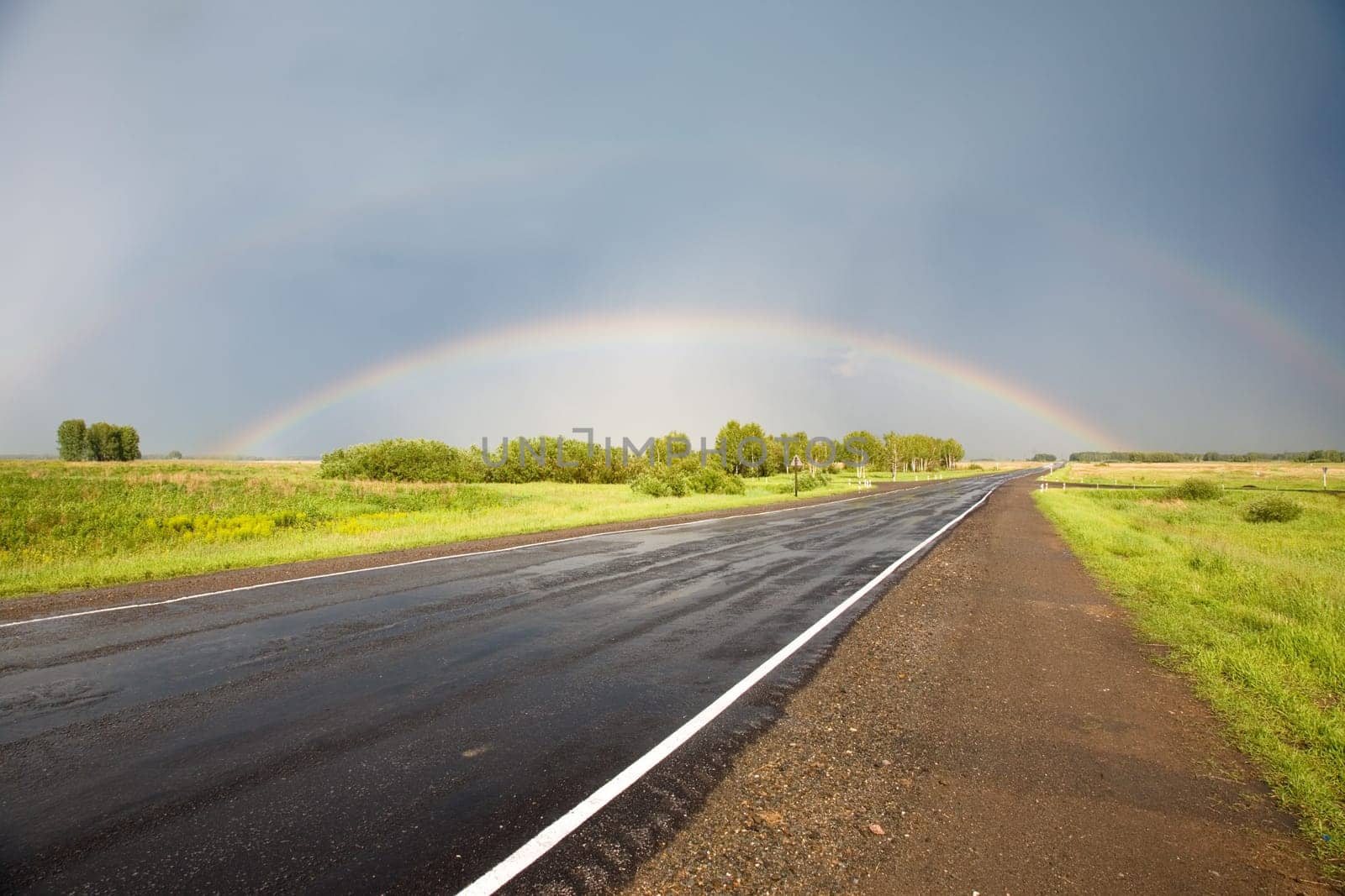 Road to the rainbow. After thunderstorm, Novosibirsk area, June 2007