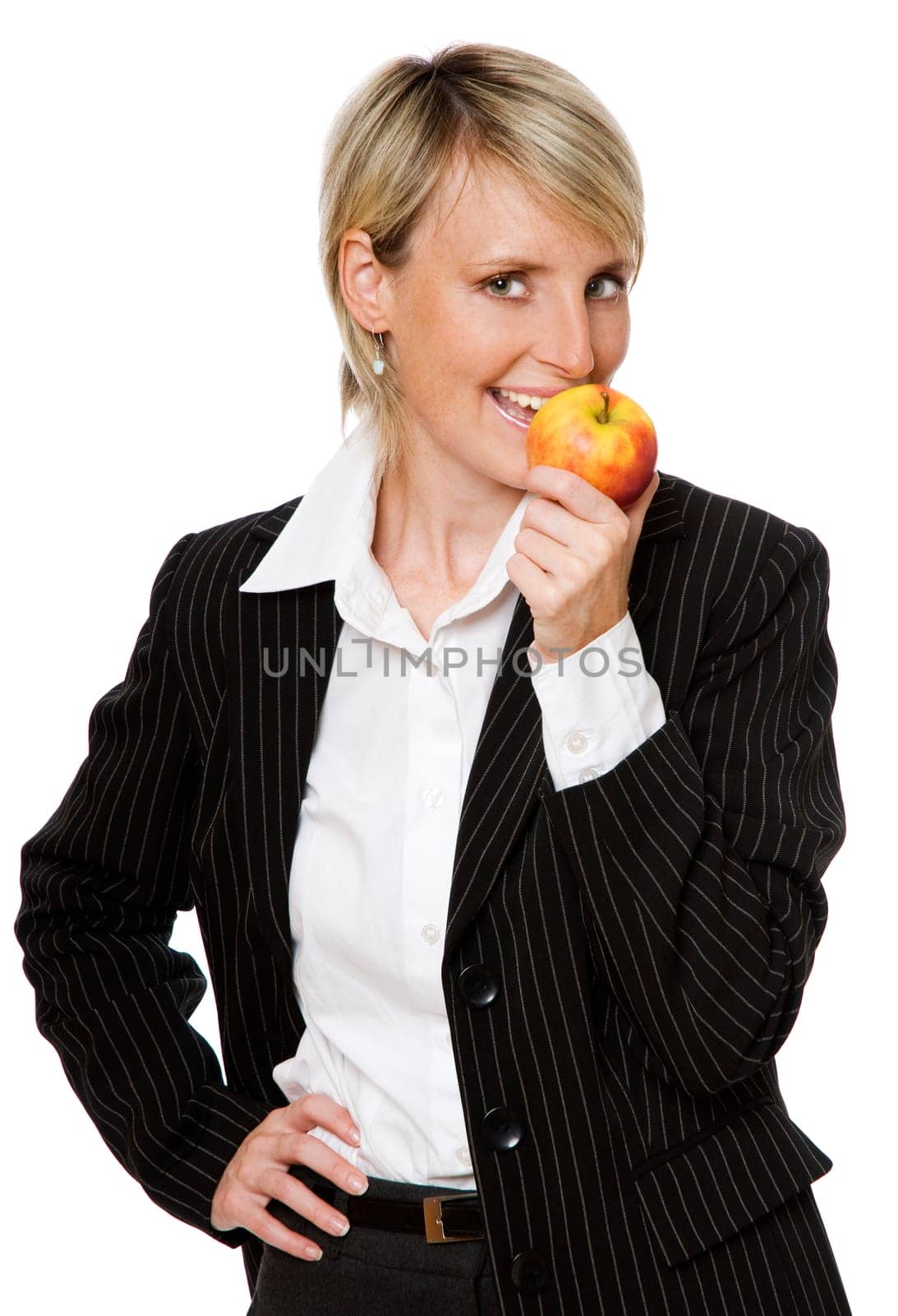 young beautiful blond woman eating apple close up