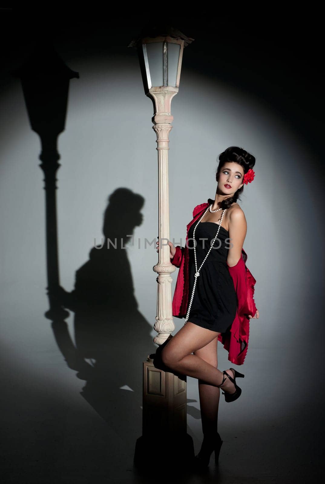 beautiful young glamorous woman  with lightpole